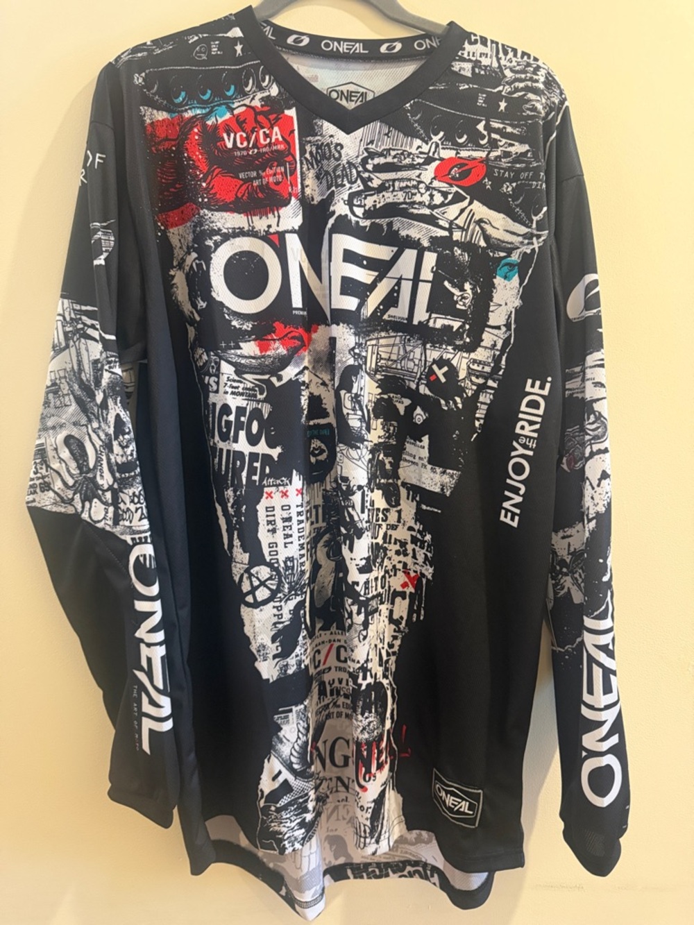 O'Neill Black Graphic Long Sleeve Jersey with Red & Teal Accents